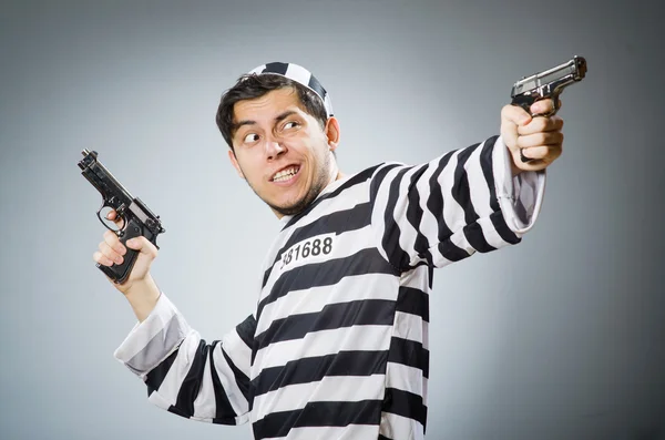 Prisoner with guns — Stock Photo, Image