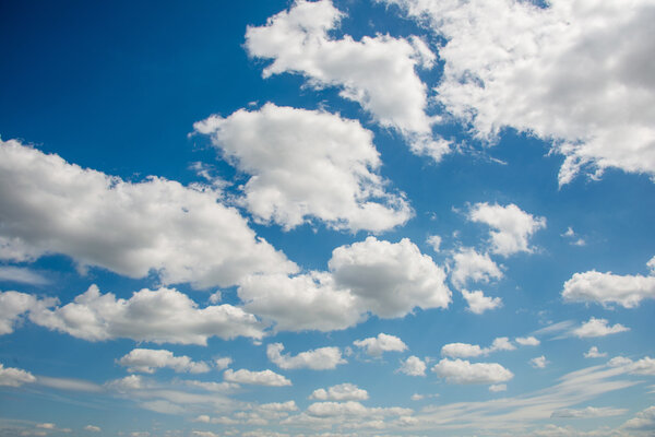 Cloudscape of bright blue sky