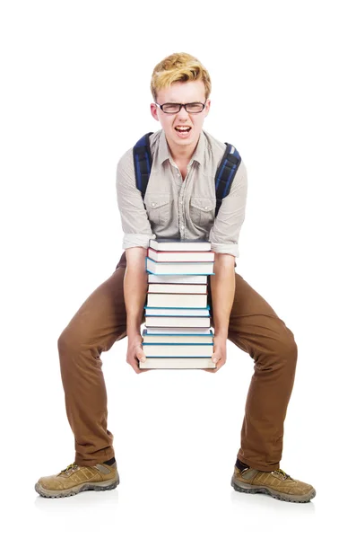 Estudante engraçado com pilha de livros — Fotografia de Stock