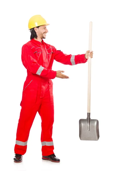 Człowiek w czerwonym kombinezonie z łopatą — Zdjęcie stockowe