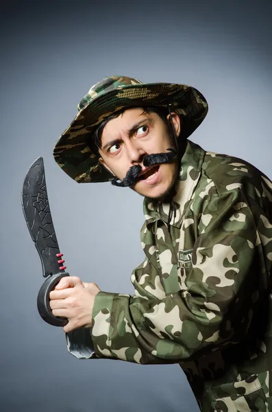 Funny soldier against the dark background — Stock Photo, Image