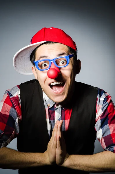 Funny clown against the dark background — Stock Photo, Image