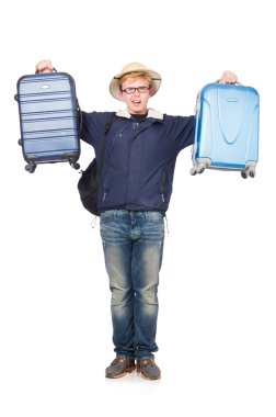 Safari şapkası takan bavullu komik bir adam.