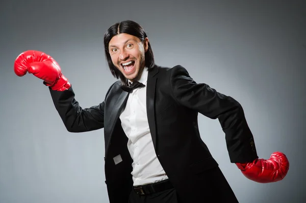 Man businessman with boxing gloves — Stock Photo, Image