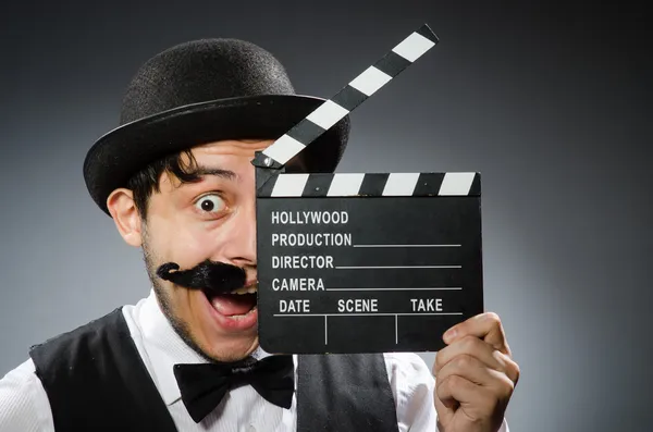 Funny man with movie clapper board — Stock Photo, Image
