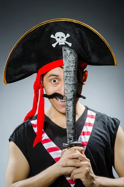 Funny pirate in the dark studio — Stock Photo, Image