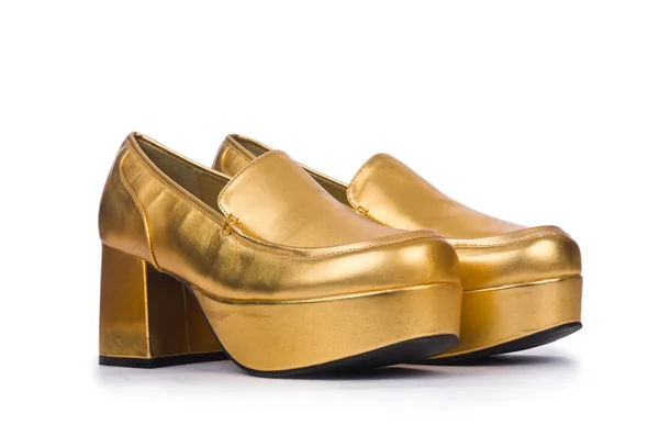 Gouden vrouw schoenen geïsoleerd op de witte — Stockfoto