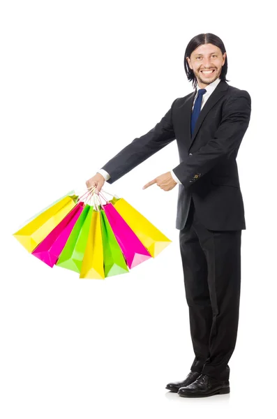 Homem com sacos de compras isolados em branco — Fotografia de Stock