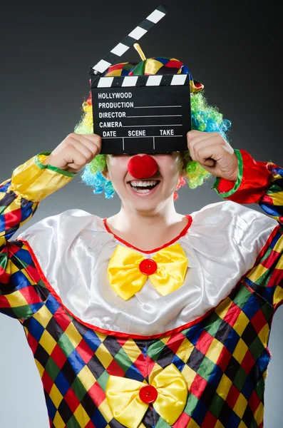 Clown with the movie board — Stock Photo, Image