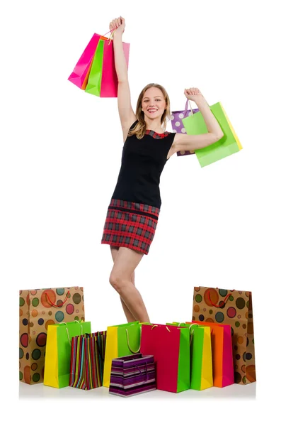 Jonge vrouw na het winkelen geïsoleerd op de witte — Stockfoto