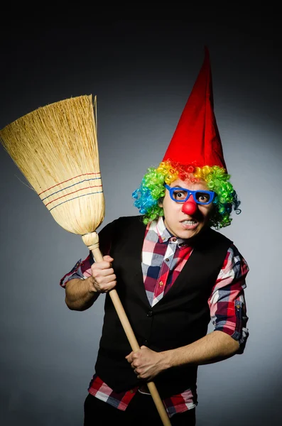 Funny clown with the broom — Stock Photo, Image