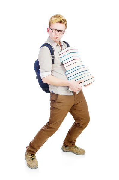Забавный студент со стопкой книг — стоковое фото