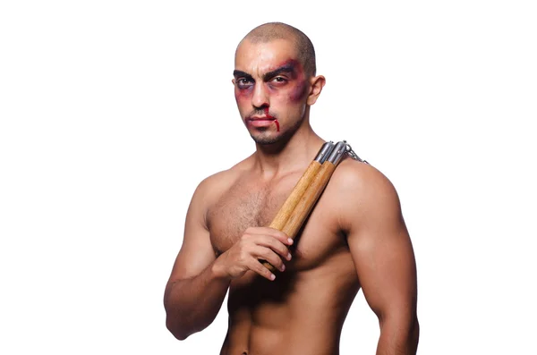 Hombre con nunchucks aislado en blanco — Foto de Stock