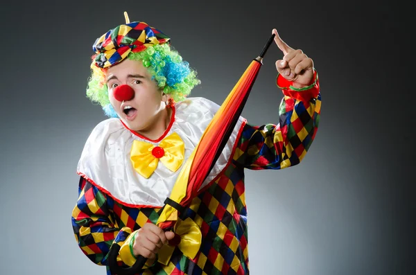 Funny clown with colourful umbrella — Stock Photo, Image