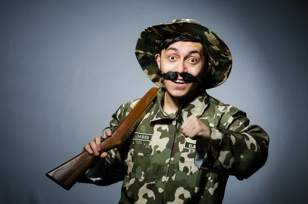 Funny soldier against the dark background — Stock Photo, Image