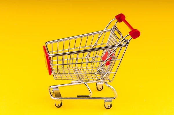 Carrito de compras sobre fondo sin costuras — Foto de Stock