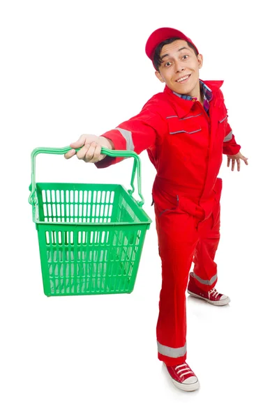 Alışveriş arabası olan kırmızı tulumlu bir adam. — Stok fotoğraf