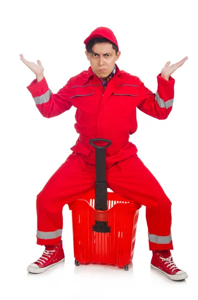 Man in red coveralls with shopping supermarket cart trolley — Stock Photo, Image