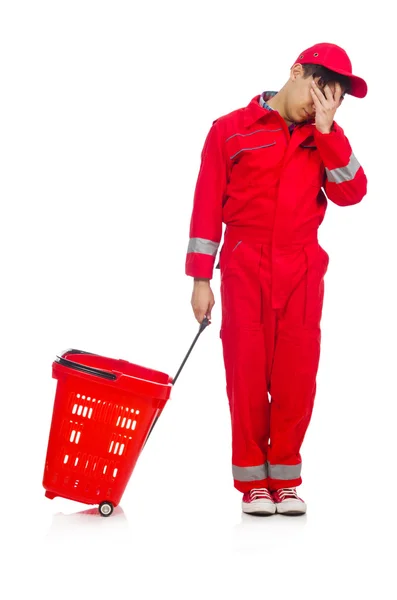 Férfi piros overallban bevásárlókocsival — Stock Fotó