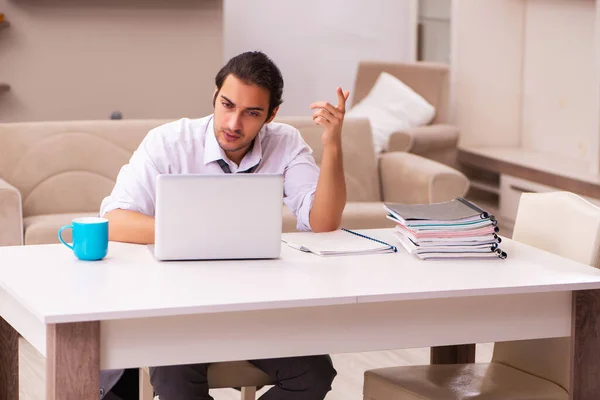 Young male employee working from home during pandemic — Stock Photo, Image