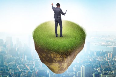 Yüzen adada iş adamı konsepti