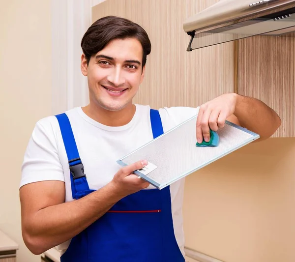 Young man working with kitchen equipment — Stock Photo, Image