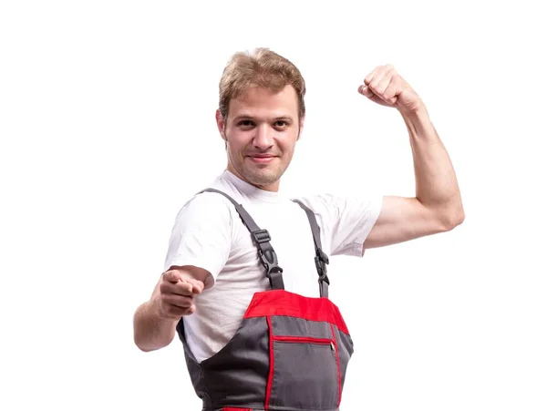 Joven trabajador de la construcción con monos aislados en blanco — Foto de Stock