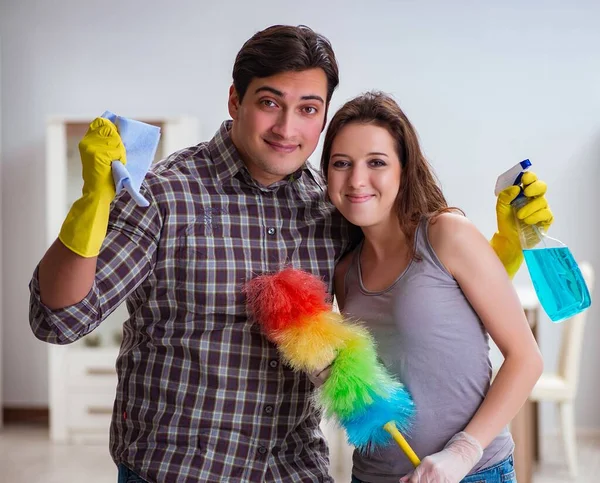 Wife and husband doing cleaning at home — Stock Photo, Image