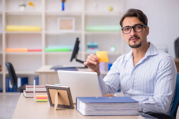 Young male employee working in the office — Stock Photo, Image