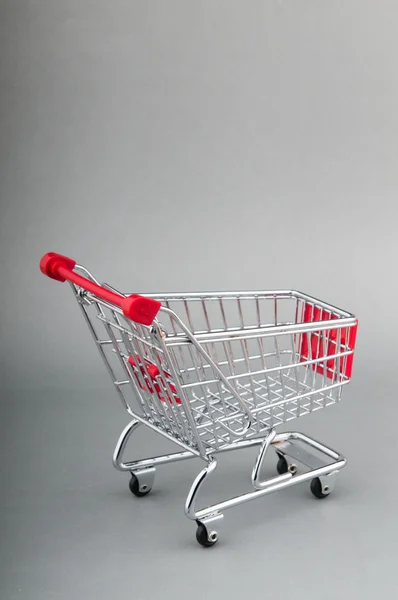 Shopping cart on seamless background — Stock Photo, Image