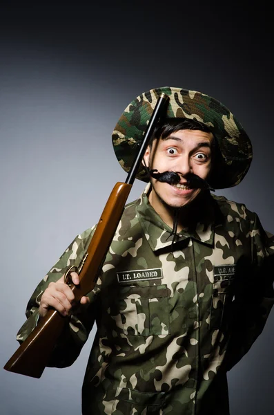 Funny soldier against the dark background — Stock Photo, Image