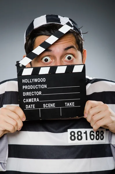 Inmate with movie clapper board — Stock Photo, Image