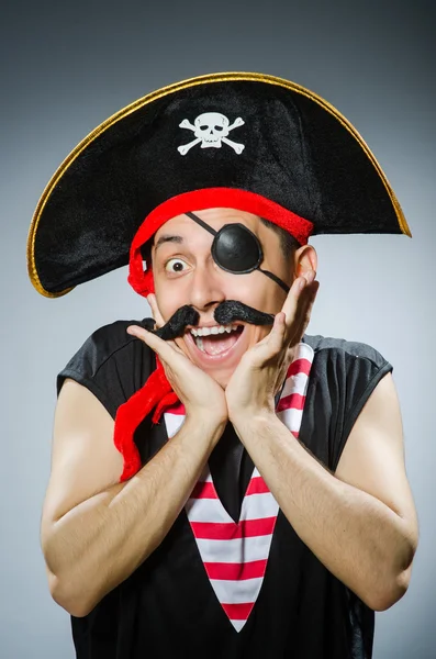 Funny pirate in the dark studio — Stock Photo, Image