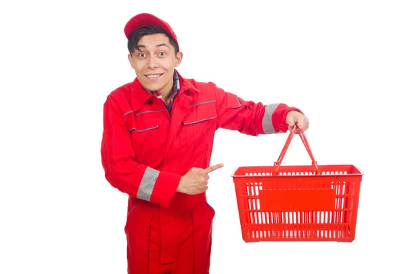 Homem em macacões vermelhos com carrinho de supermercado de compras carrinho — Fotografia de Stock