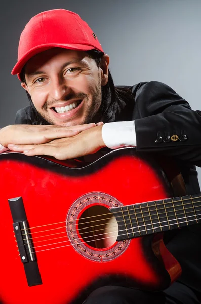 Funny guitar player in studio — Stock Photo, Image