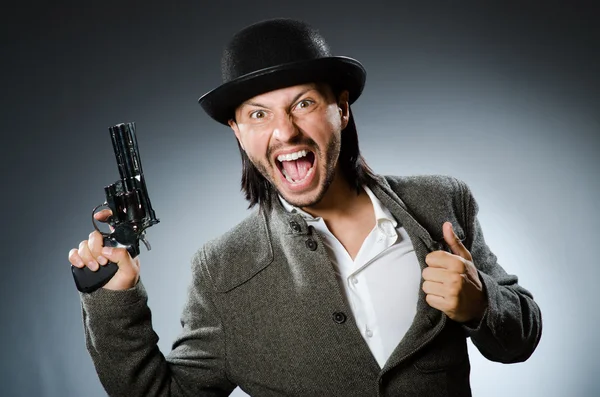 Man with gun and vintage hat — Stock Photo, Image