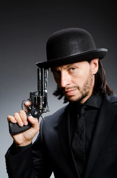 Man with gun and vintage hat — Stock Photo, Image