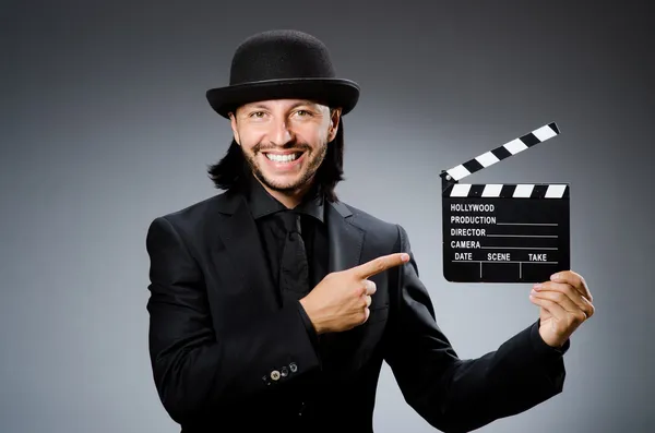 Mann mit Filmplatte und Hut — Stockfoto