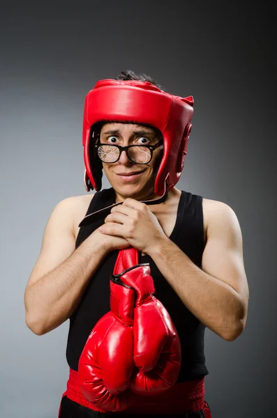 Funny boxer with red gloves against dark background — Stock Photo, Image