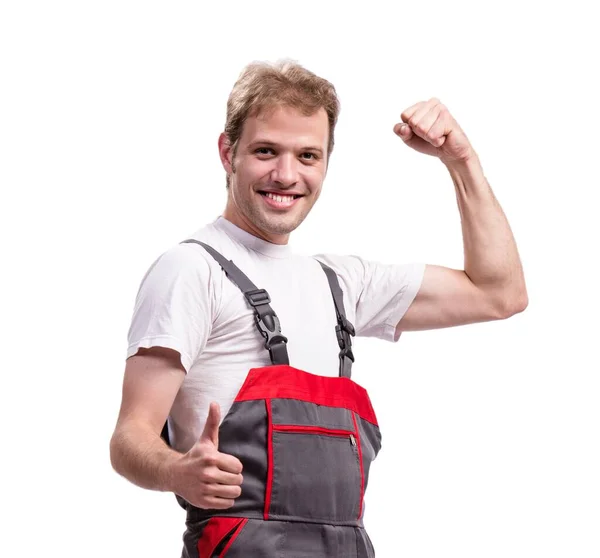 Joven trabajador de la construcción con monos aislados en blanco —  Fotos de Stock