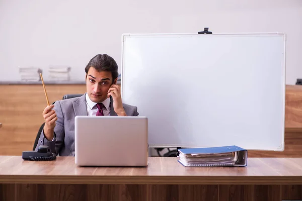 Young male business trainer in the office during pandemic — Stock Photo, Image