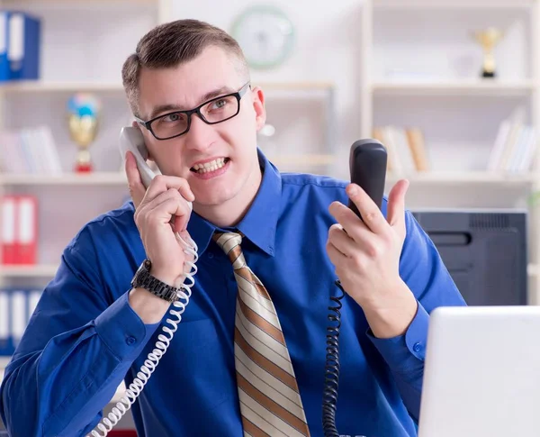 Young businessman employee working in office at desk — Stock Photo, Image