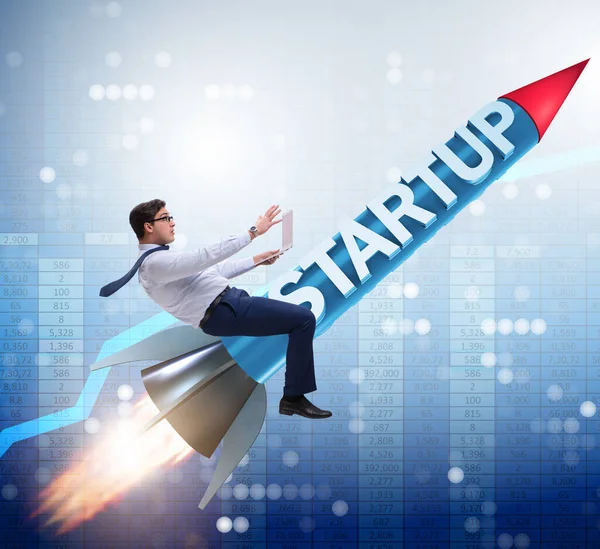 Businessman in start-up concept flying on rocket — Stock Photo, Image