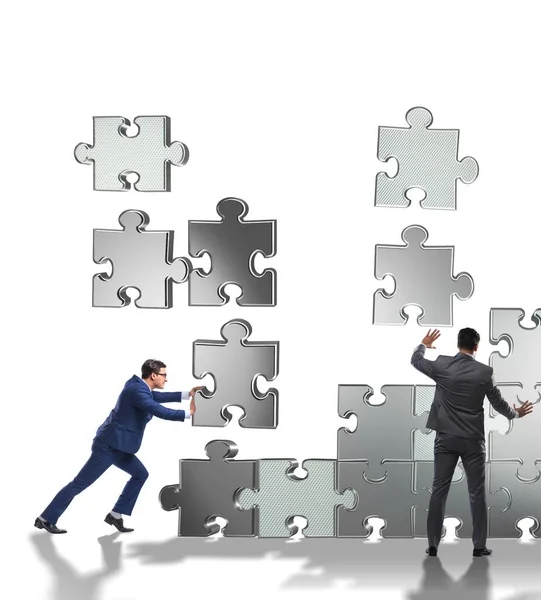 Geschäftskonzept der Teamarbeit mit Puzzleteilen — Stockfoto