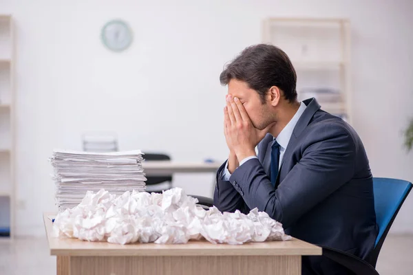 Young male employee in brainstorming concept — Stock Photo, Image