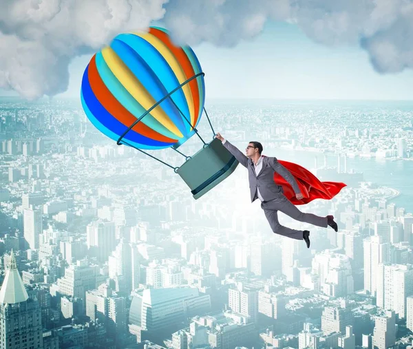 Hombre de negocios volando en globo en concepto de desafío —  Fotos de Stock
