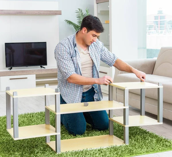 Man assembling furniture at home — Stock Photo, Image