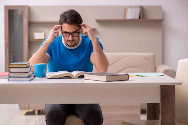 Young male student studying at home — Stock Photo, Image