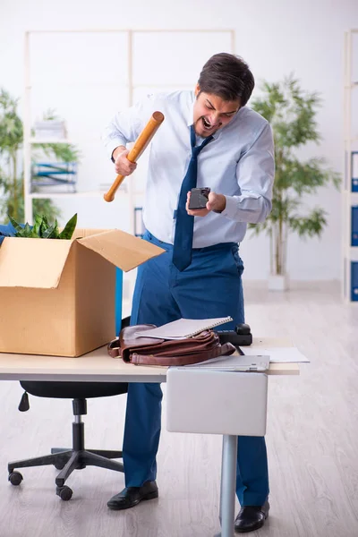 Young male employee in business relocation concept — Stock Photo, Image