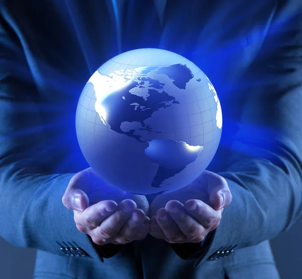 Businessman holding globe in global business concept — Stock Photo, Image